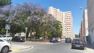 a city street with cars parked on the street at Estadio 3 in Cádiz