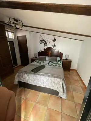 a bedroom with a large bed in a room at Esencia de Arcos in Arcos de la Frontera