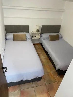 two beds sitting next to each other in a room at Esencia de Arcos in Arcos de la Frontera