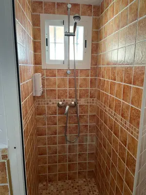 a bathroom with a shower with a shower head at Esencia de Arcos in Arcos de la Frontera