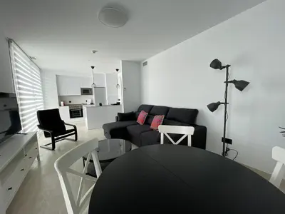 a living room with a couch and a table at LHOME CÁDIZ in Cádiz