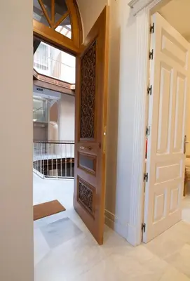 a door leading into a room with a balcony at inncadizCasa Apolo in Cádiz