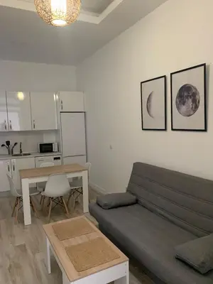 a living room with a couch and a table at Luna Alameda Grupo AC Gestion in Cádiz