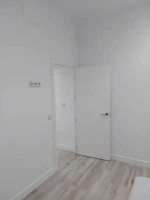 an empty room with white walls and white closets at Luna Alameda Grupo AC Gestion in Cádiz
