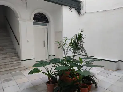 a building with plants in front of a door at Luna Alameda Grupo AC Gestion in Cádiz