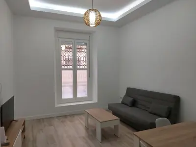 a living room with a couch and a table at Sol Alameda Grupo AC Gestion in Cádiz