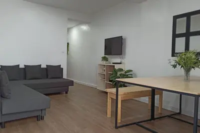 a living room with a couch and a table at Acogedor piso centro, San Miguel in Jerez de la Frontera