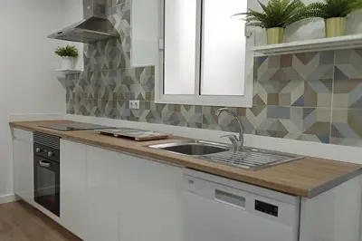 a kitchen with a sink and a counter top at Acogedor piso centro, San Miguel in Jerez de la Frontera