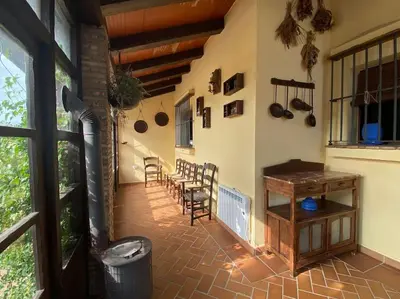 a patio with a table and chairs in a room at Gran Casa con Piscina Privada by Chiclana Dreams in Chiclana de la Frontera