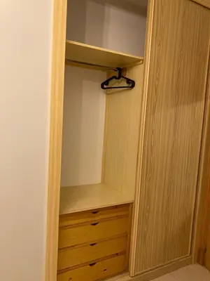 a closet with a wooden cabinet and a drawer at APARTAMENTO LOS ALTOS DE EL PUERTO - Calidad, Garaje y WiFi in El Puerto de Santa María