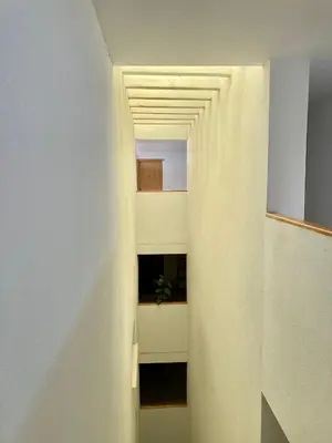 a hallway in a house with a white ceiling at ÁTICO VALDELAGRANA PLAYA - Aire Acondicionado y Piscina in El Puerto de Santa María