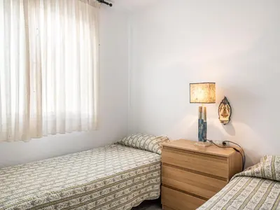 a bedroom with two twin beds and a window at Villa Cristina by Interhome in Conil de la Frontera