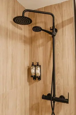 a shower with two candles on the wall at esZentrico Suites Jerez in Jerez de la Frontera