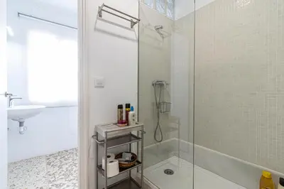 a bathroom with a shower and a glass shower stall at Allo Apartments Plaza Arenal Centro 2 Habitaciones in Jerez de la Frontera