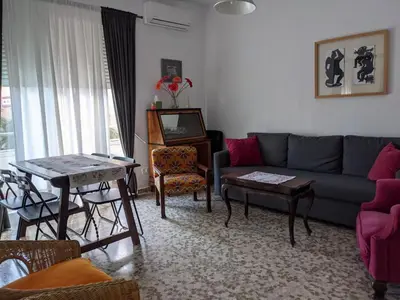 a living room with a couch and a table at Allo Apartments Plaza Arenal Centro 2 Habitaciones in Jerez de la Frontera