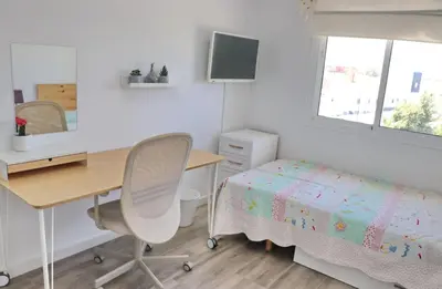 a bedroom with a desk and a bed and a desk and chair at Apartamento Angel in San Fernando