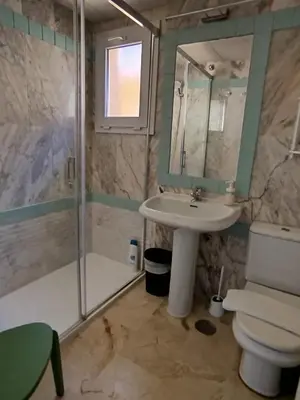 a bathroom with a sink and a shower and a toilet at Novo Sancti Petri, La Barrosa, 2 Beds Room Apartamento by Chiclana Dreams in Chiclana de la Frontera