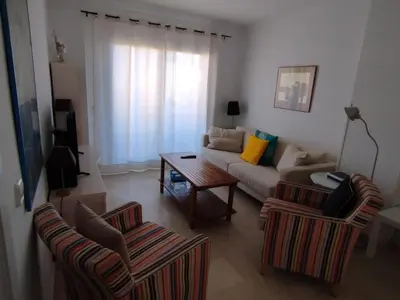 a living room with a couch and two chairs at Novo Sancti Petri, La Barrosa, 2 Beds Room Apartamento by Chiclana Dreams in Chiclana de la Frontera