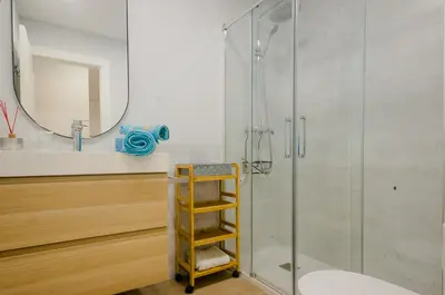 a bathroom with a shower and a glass shower stall at Laja Bermeja, piscina y primera línea de La Barrosa in Chiclana de la Frontera
