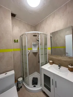 a bathroom with a shower and a sink at Precioso Apto con vistas al Parque Nacional Doñana in Chipiona