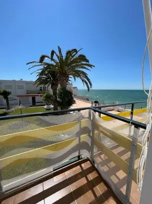 a balcony with a view of the beach at Precioso Apto con vistas al Parque Nacional Doñana in Chipiona