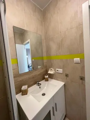 a bathroom with a sink and a mirror at Precioso Apto con vistas al Parque Nacional Doñana in Chipiona