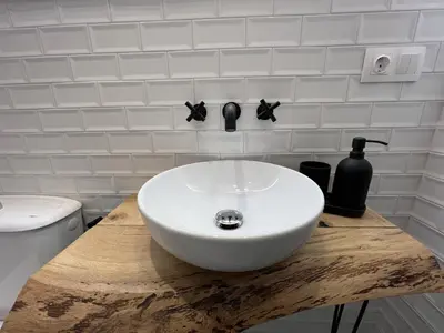 a white sink on a wooden counter in a bathroom at Patiovecino Apartment Centro de Cádiz in Cádiz