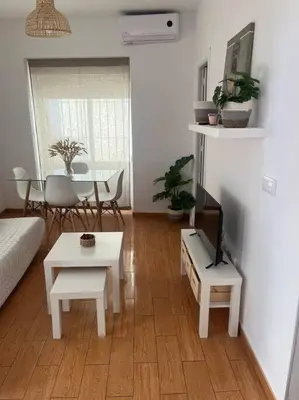 a living room with a couch and a table at Apartamento Veracruz in Rota