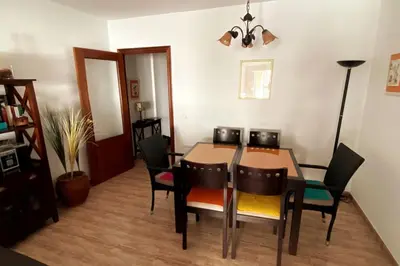 a dining room with a table and chairs at Apartamento a unos pasos de la Playa (Rota) in Rota