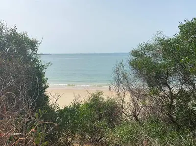 a beach with the ocean in the background at Apartamento a unos pasos de la Playa (Rota) in Rota