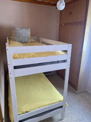 a couple of bunk beds in a room at Piso coqueto céntrico en Jerez (San Miguel) in Jerez de la Frontera