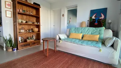 a living room with a couch and a table at Casa Costa Ecologica y de Design con Piscina, Jardin y Parking in Chiclana de la Frontera