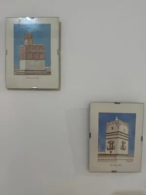 two pictures of a building on a wall at Apartamento Casa Palacio 1890. in El Puerto de Santa María