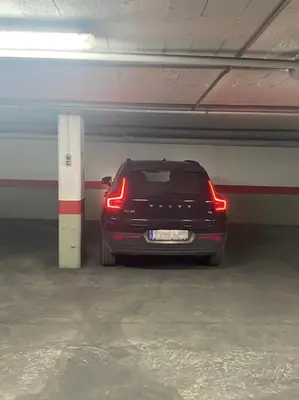 a car is parked in a parking garage at Apartamento Casa Palacio 1890. in El Puerto de Santa María