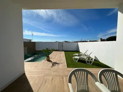 a view of the backyard from the balcony of a house at Sumatra Chalet in Chiclana de la Frontera
