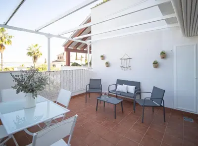 a white bedroom with a bed and a closet at SibsSanlucar Donana 1ª Línea Playa-Piscina-Padel in Sanlúcar de Barrameda