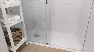 a shower with a glass door in a bathroom at Sherryflat Porvenir in Jerez de la Frontera