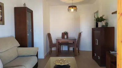 a living room with a couch and a table at Sherryflat Porvenir in Jerez de la Frontera