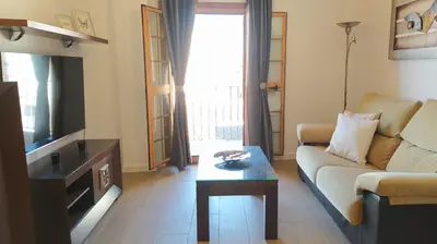 a living room with a couch and a coffee table at Sherryflat Porvenir in Jerez de la Frontera