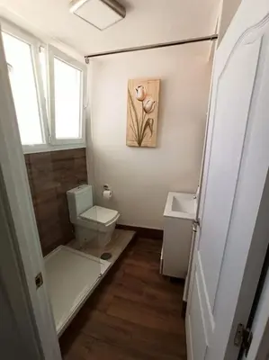 a small bathroom with a toilet and a sink at ÁTICO SANTA MARÍA in Cádiz