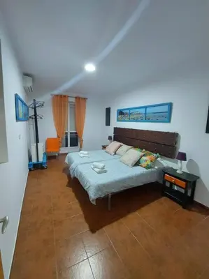 a bedroom with a bed in a room at APARTAMENTO SANTA MARÍA in Cádiz