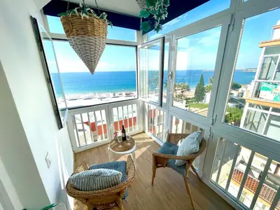 a room with a view of the ocean at GATU Casa Muse junto a la playa, vista al mar, aire acc, terraza, wifi y chimenea 