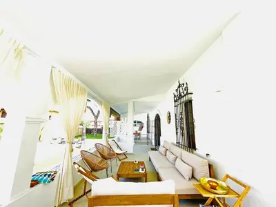 a living room with a couch and chairs at Villa Velero - Ole Solutions in Sanlúcar de Barrameda