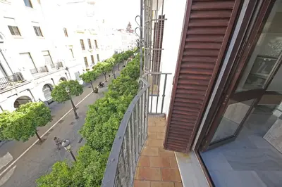 a balcony with a view of a street at Allo Apartments Larga Hideaway Parking Centro 2 Habitaciones in Jerez de la Frontera