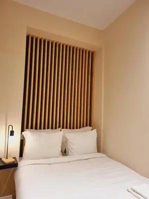 a bedroom with two beds and a large window at AUJADA CENTRO in Cádiz