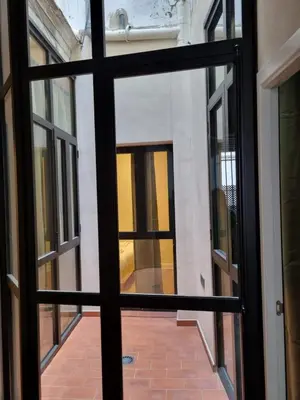 a view through a glass door of a building at AUJADA CENTRO in Cádiz