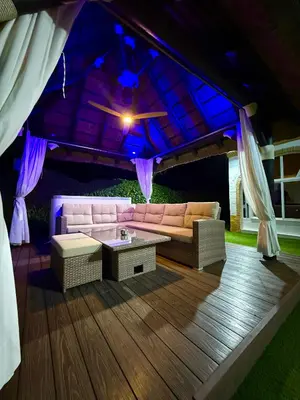 a living room with a couch and a table at VILLA MACARENA in Espera