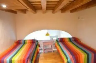 a room with two striped chairs in a room at APARTAMENTO VEEDOR BULEVAR DE LOS SUEÑOS in Cádiz