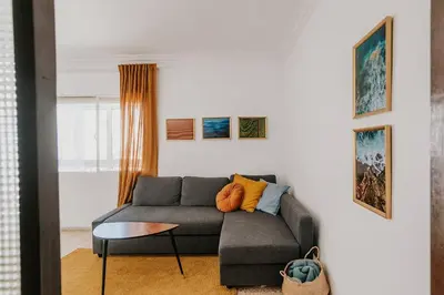 a living room with a couch and a table at Apartamento Valdés - Ole Solutions in El Puerto de Santa María
