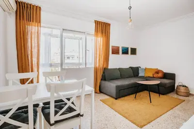 a living room with a couch and a table at Apartamento Valdés - Ole Solutions in El Puerto de Santa María
